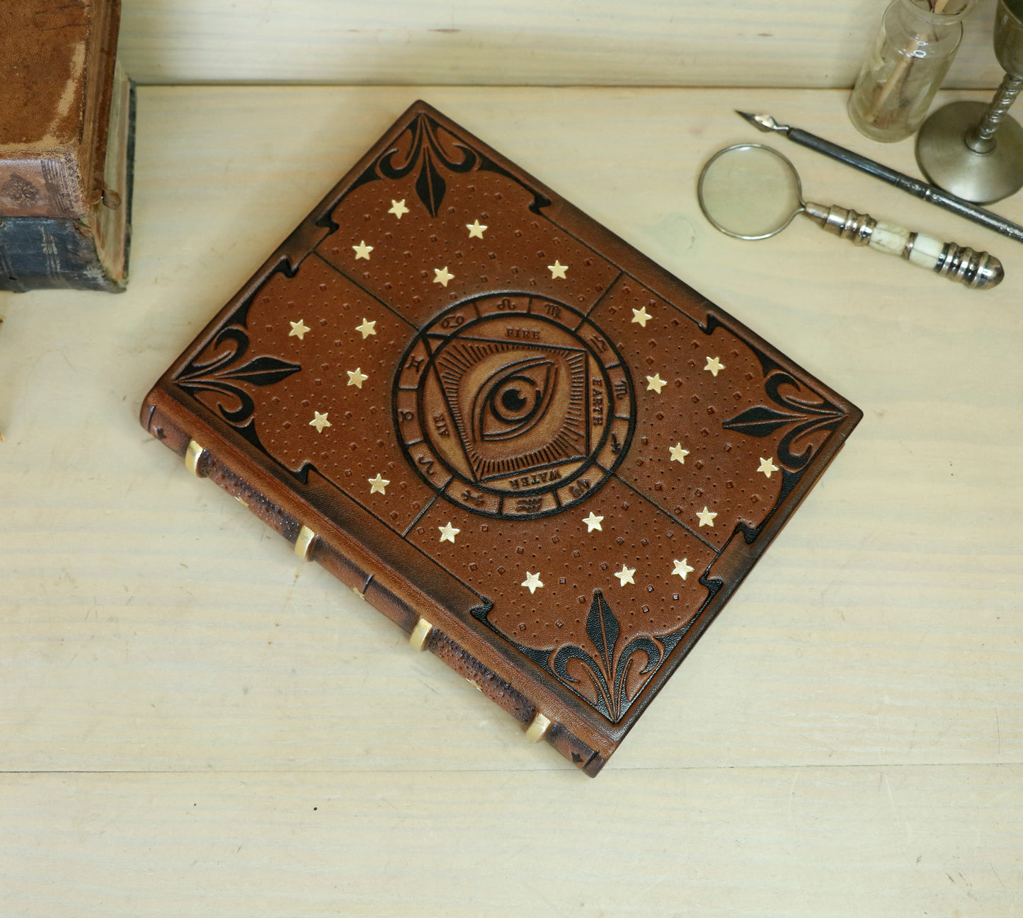 Brown leather journal with tooled decoration, The Circle of Time in Black