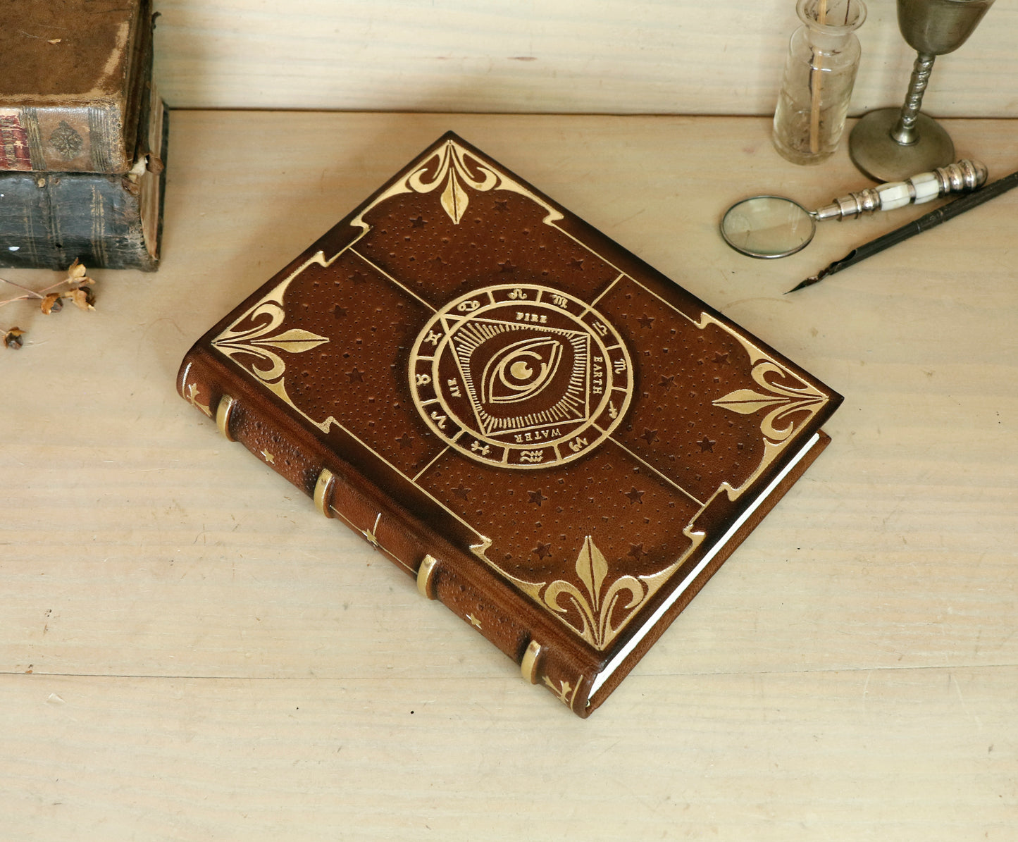 Brown leather journal with tooled decoration, The Circle of Time in Gold