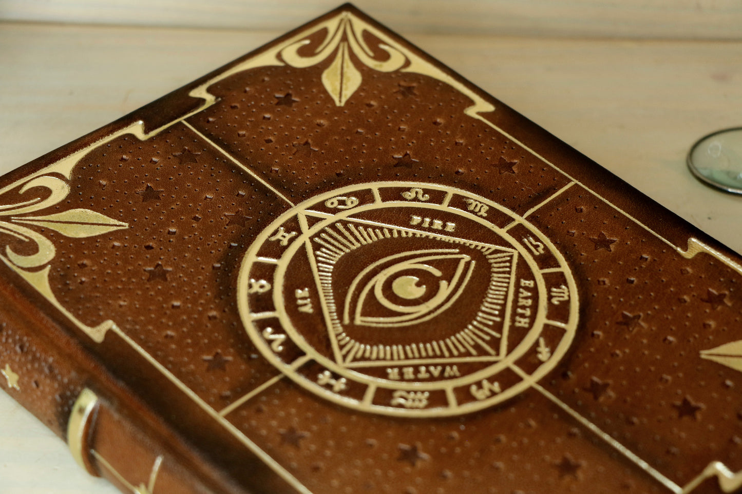 Brown leather journal with tooled decoration, The Circle of Time in Gold
