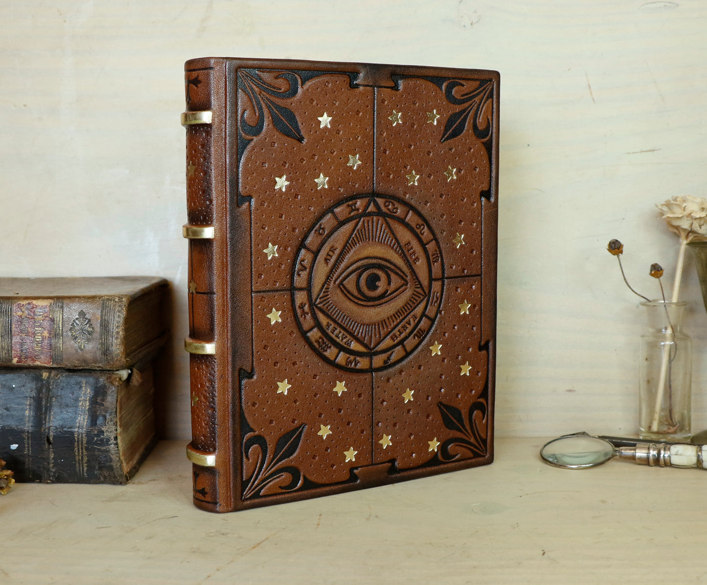 Brown leather journal with tooled decoration, The Circle of Time in Black
