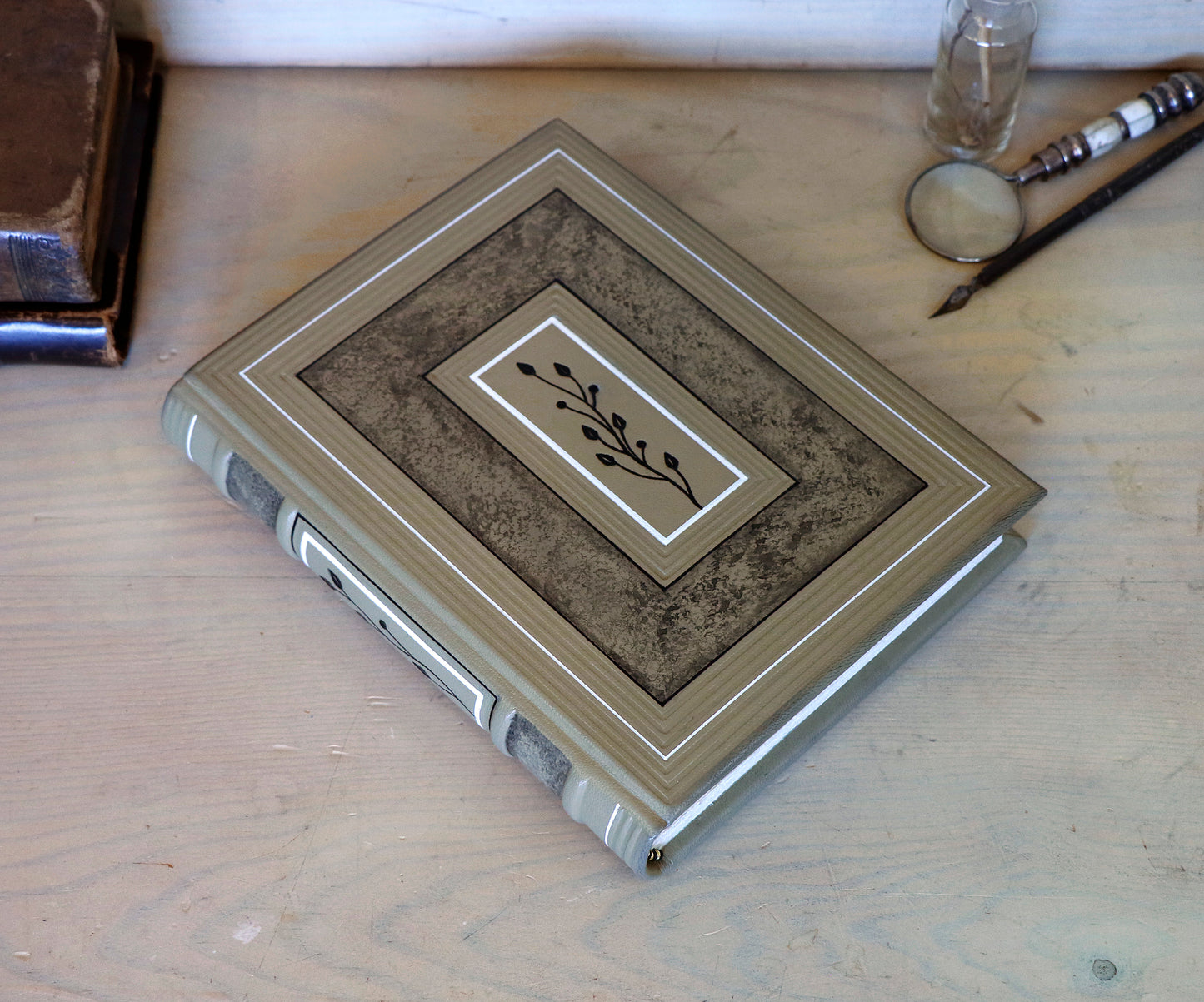 Beige leather journal with tooled floral decoration. Echoes of Earth. One of a kind.