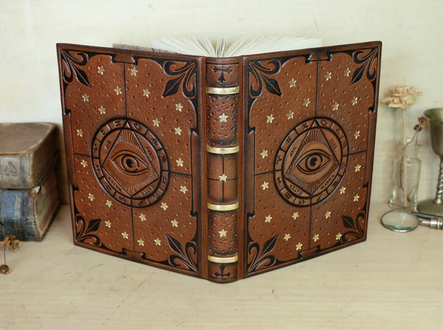 Brown leather journal with tooled decoration, The Circle of Time in Black