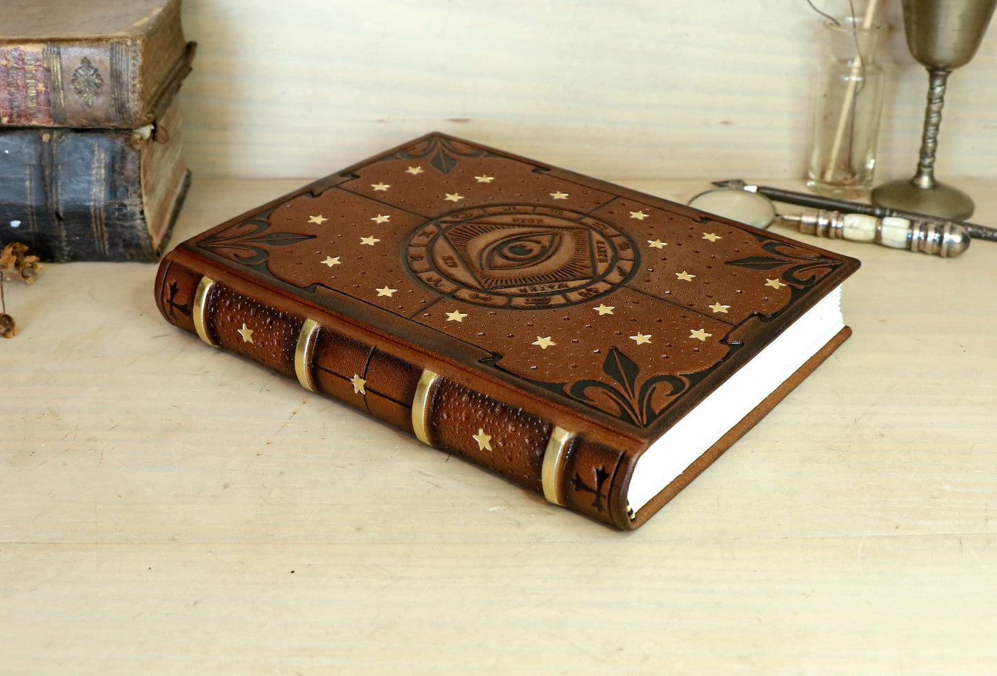 Brown leather journal with tooled decoration, The Circle of Time in Black