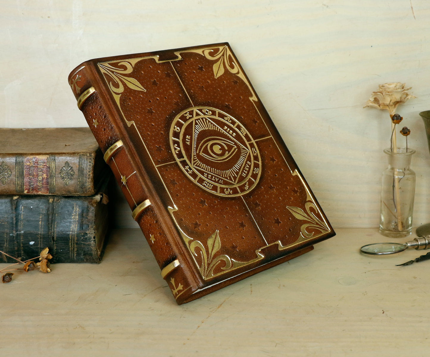 Brown leather journal with tooled decoration, The Circle of Time in Gold