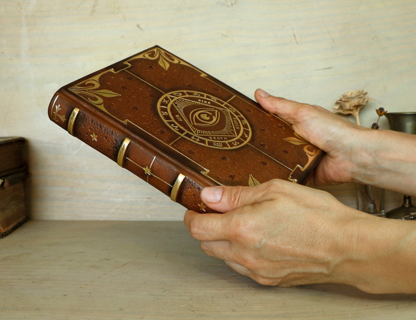Brown leather journal with tooled decoration, The Circle of Time in Gold