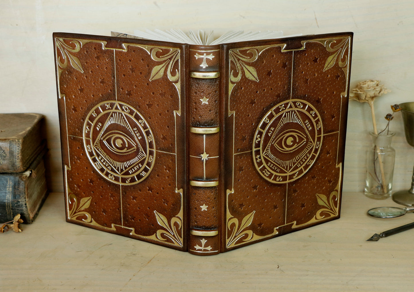 Brown leather journal with tooled decoration, The Circle of Time in Gold