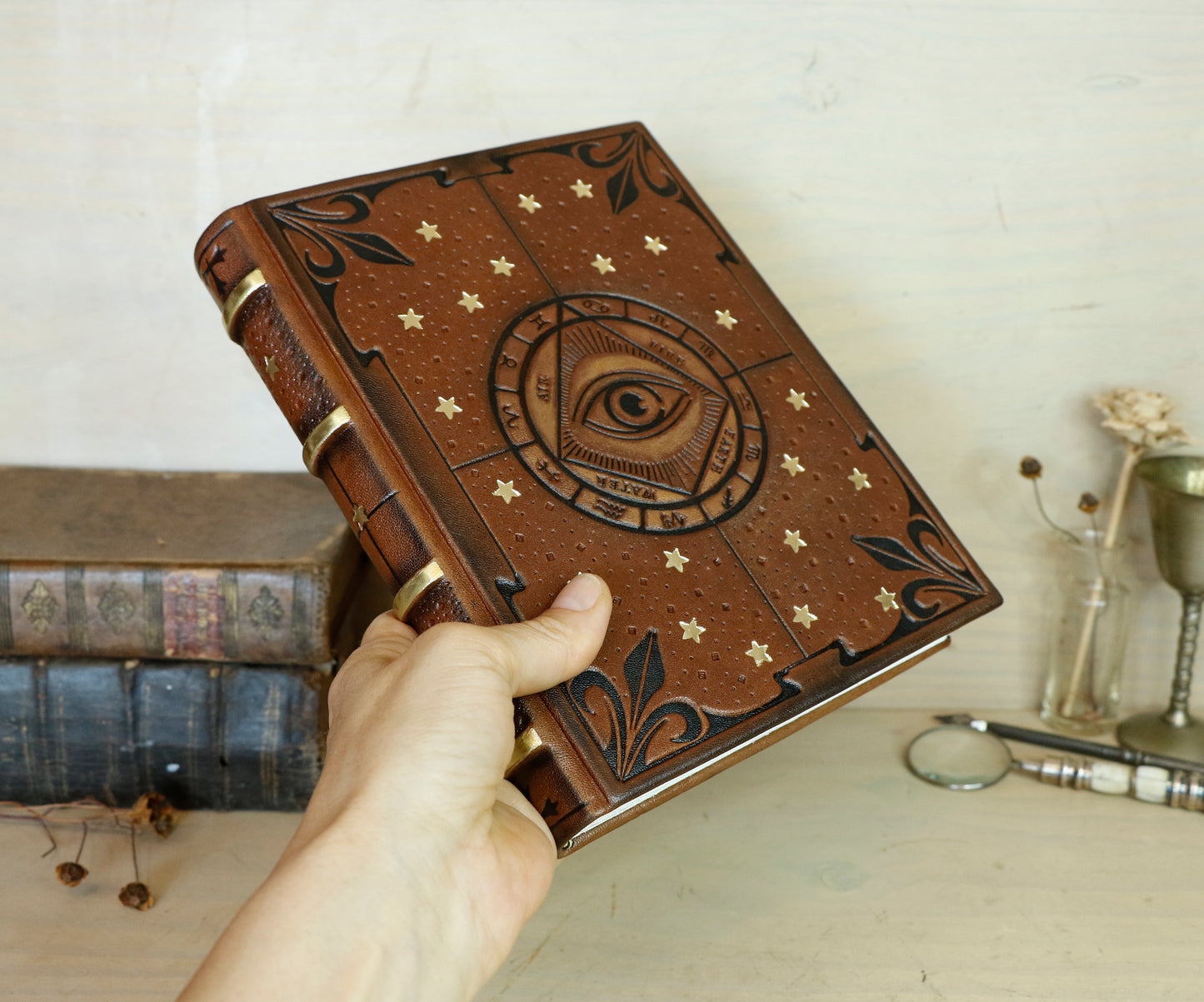 Brown leather journal with tooled decoration, The Circle of Time in Black