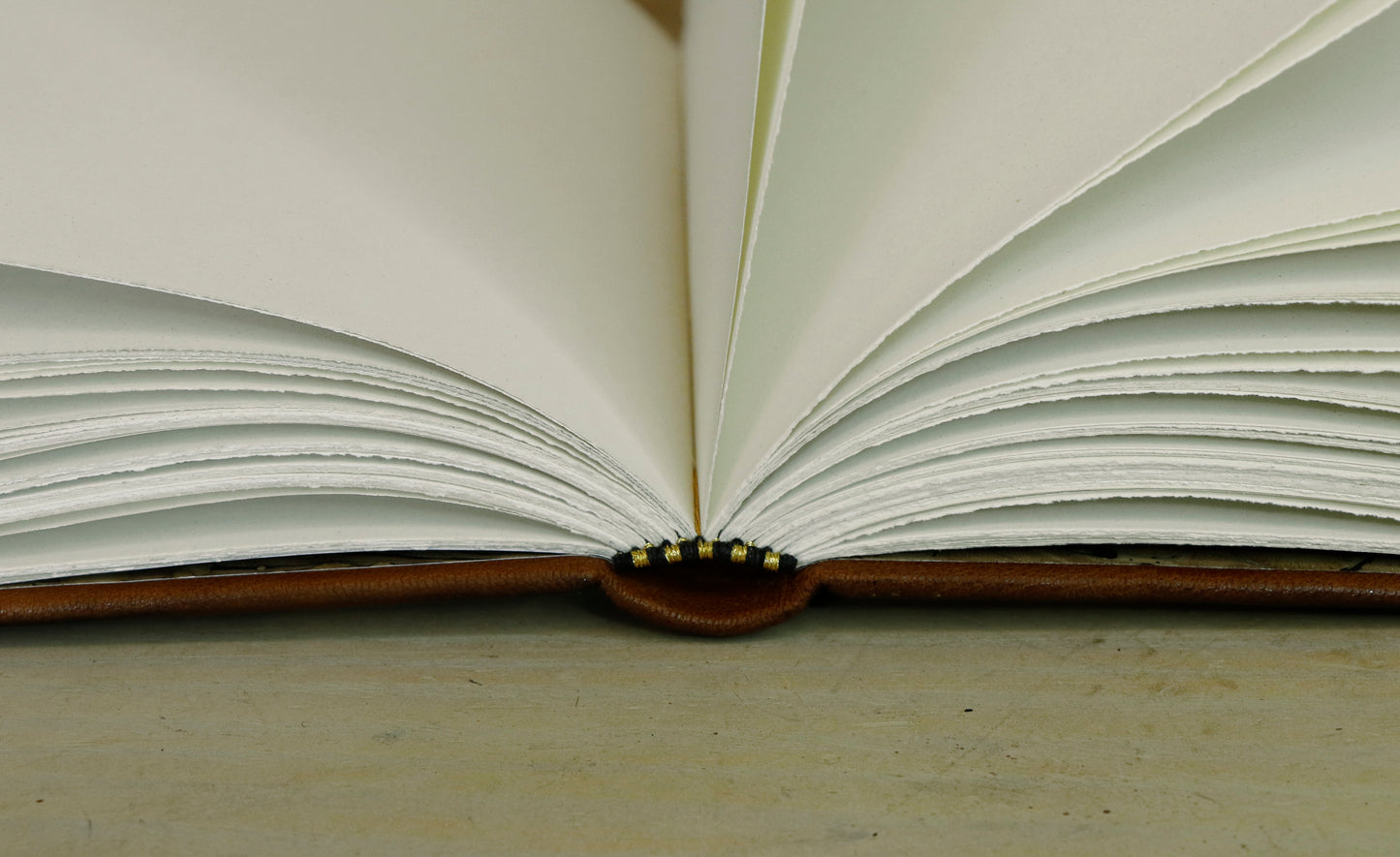 Brown leather journal with tooled decoration, The Circle of Time in Gold