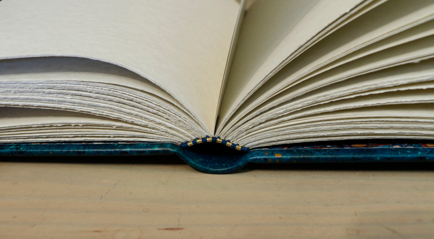 Polaris. Blue leather journal with hand marbled decoration. One of a Kind