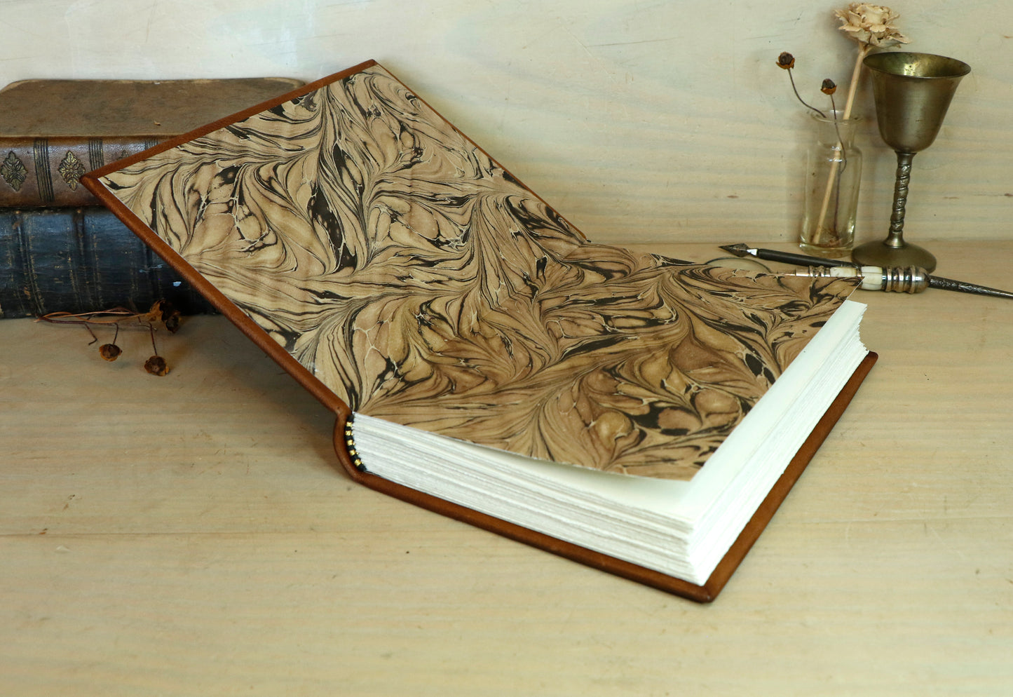 Brown leather journal with tooled decoration, The Circle of Time in Black
