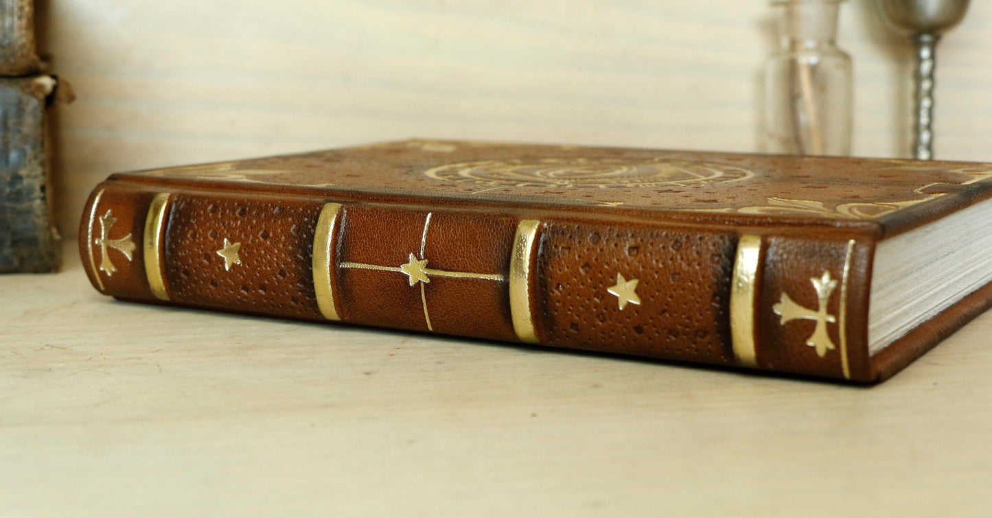 Brown leather journal with tooled decoration, The Circle of Time in Gold