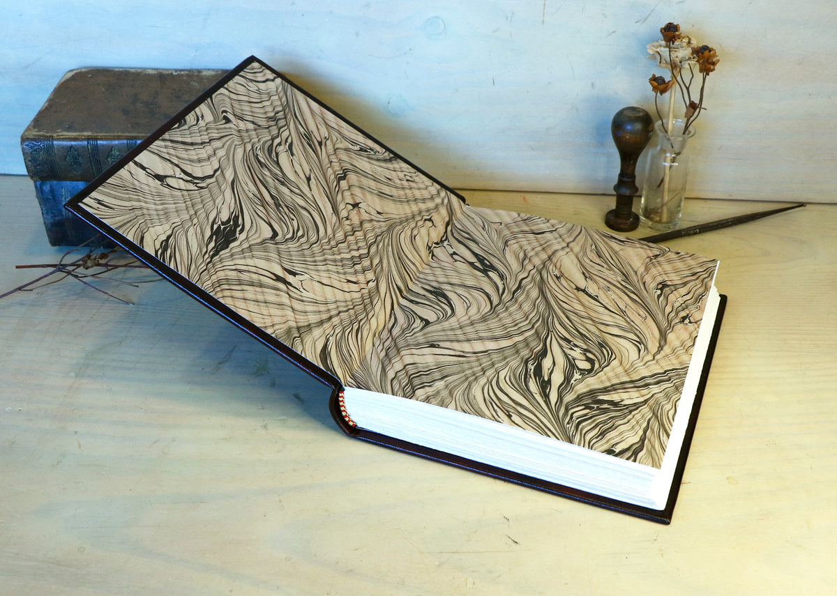 Bright red leather journal with black inlays and gold tooled decoration - The Gilded Labyrinth
