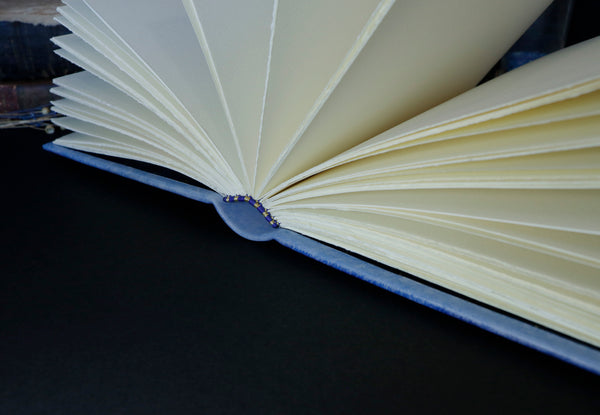 Light blue leather journal with gold tooled decoration, The Circle of Time