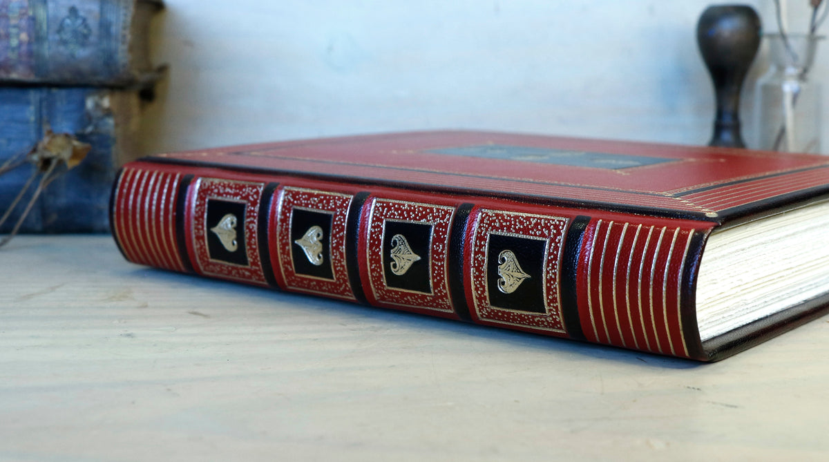 Bright red leather journal with black inlays and gold tooled decoration - The Gilded Labyrinth
