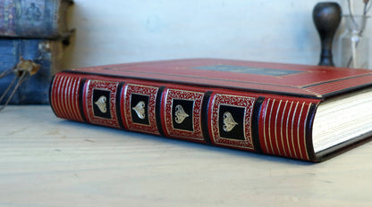 Bright red leather journal with black inlays and gold tooled decoration - The Gilded Labyrinth