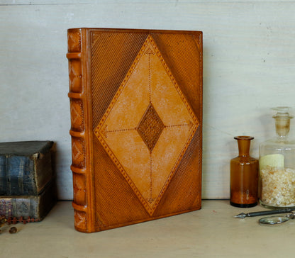 Antiqued orange leather journal with tooled decoration. Romantic Sunset II