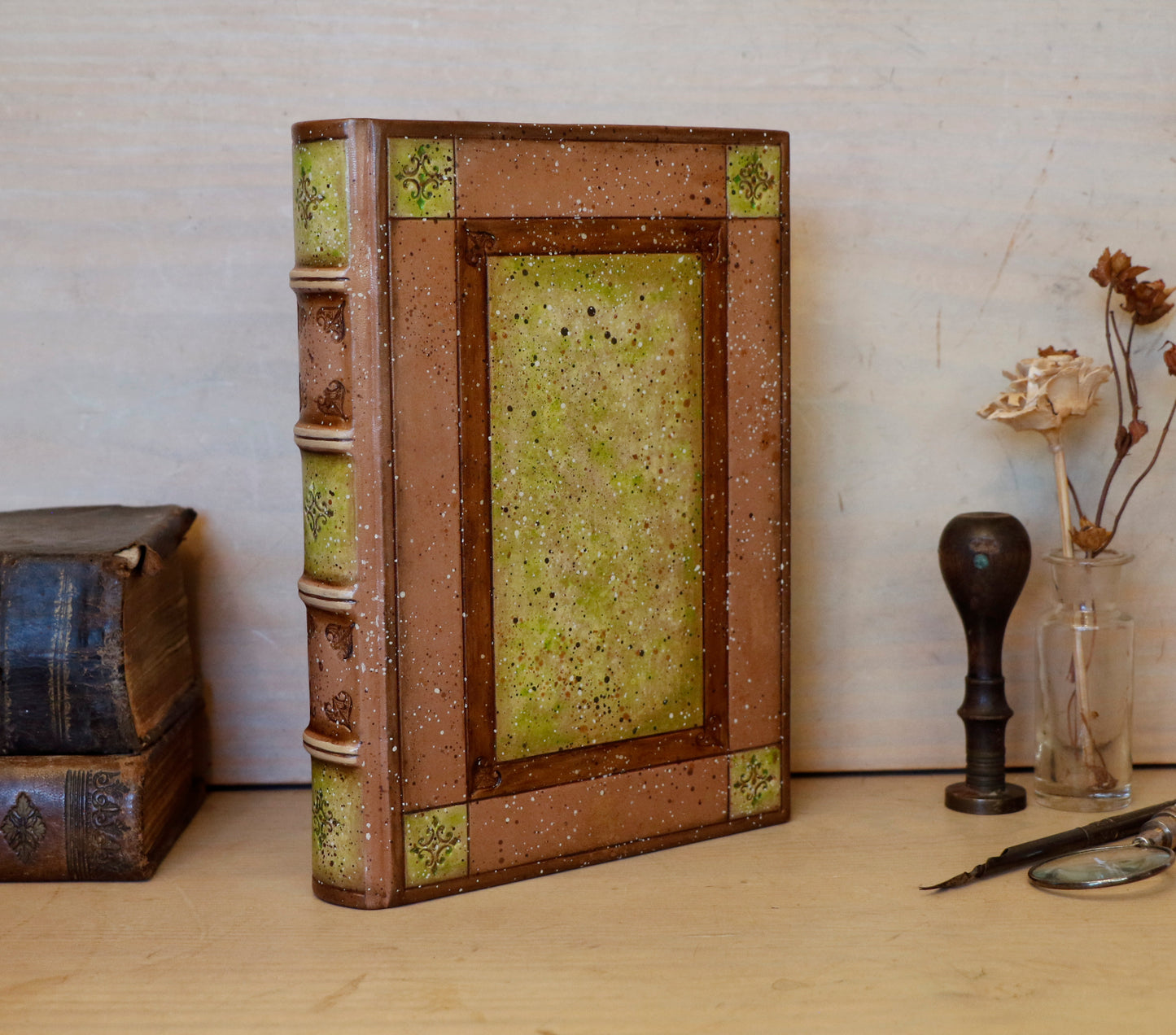 Brown leather journal with tooled and hand painted decoration. Artist paper. Mosslight
