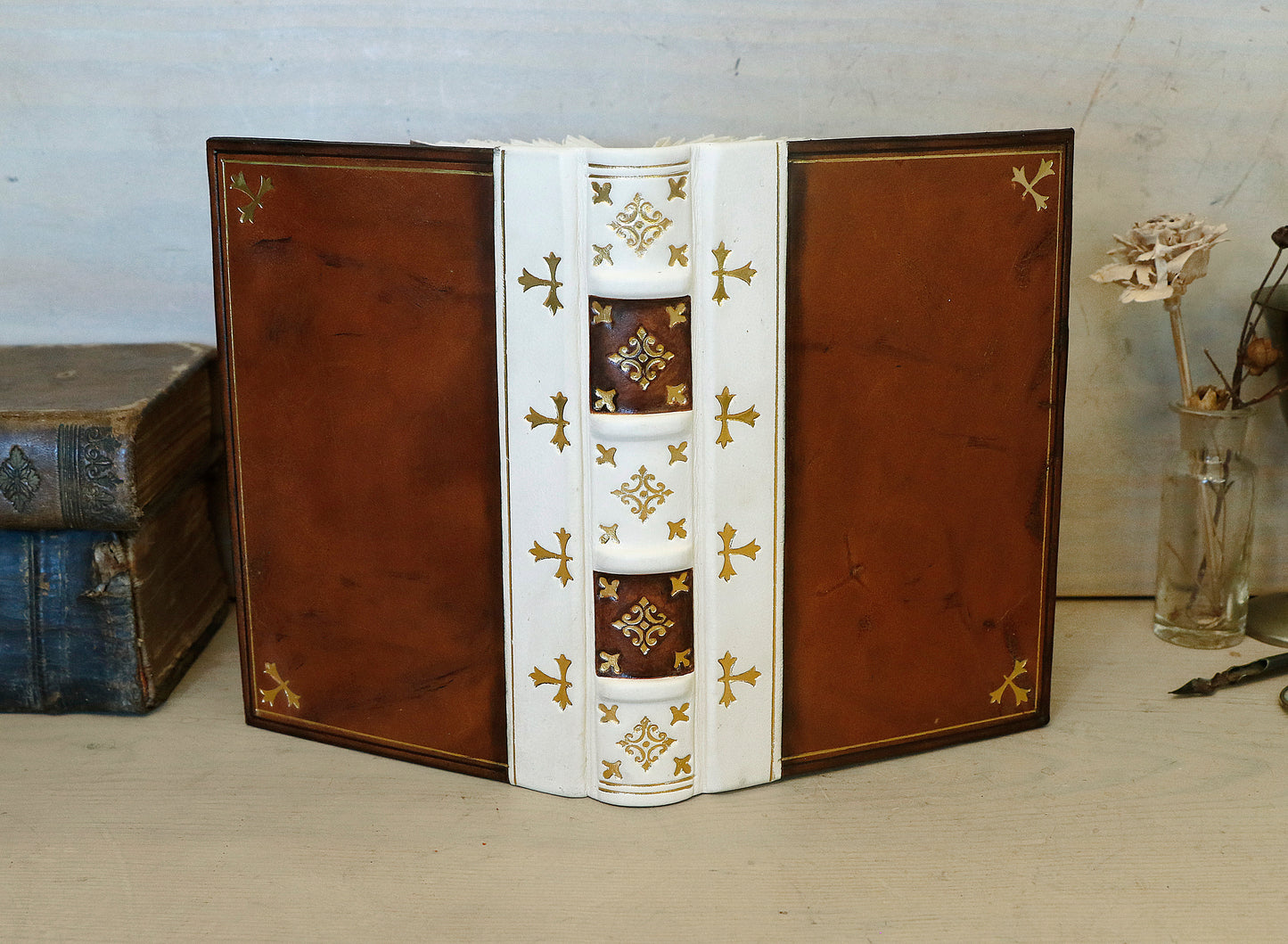 Antiqued journal, Orange-brown leather cover with white leather spine, Gold tooled decoration. The Book of Light