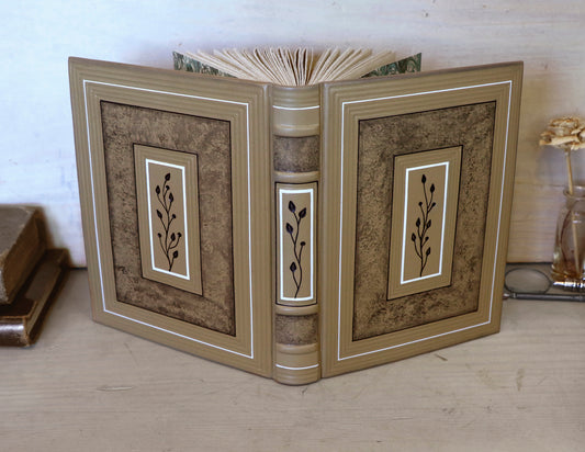 Beige leather journal with tooled floral decoration. Echoes of Earth. One of a kind.