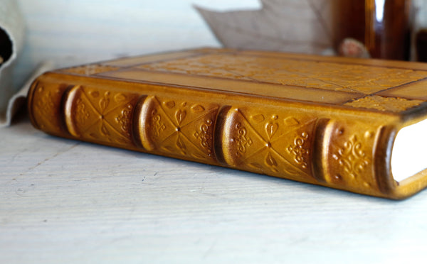 Antiqued yellow leather journal with tooled decoration. Romantic Sunset