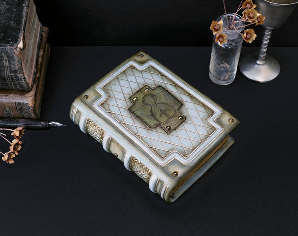 Small leather journal with brass etching of Jesus Christ, white leather with gold tooled decoration, tea stained pages