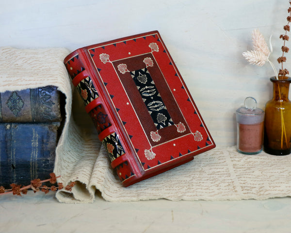 Small journal, red leather with black inlays and gold tooled decoration - Words of Passion