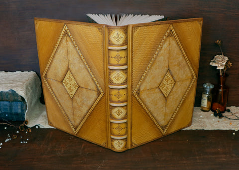 Antiqued yellow leather journal with tooled decoration. Romantic Sunset
