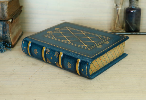 Blue leather journal with gold tooled decoration and painted edges. A Small Treasure