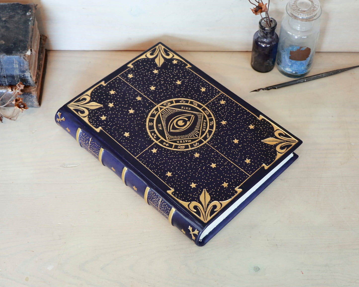 Dark blue leather journal with gold tooled decoration, The Circle of Time