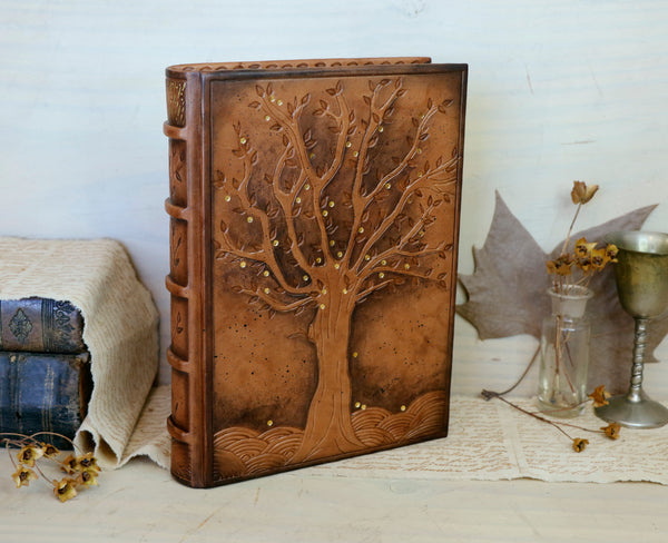 Antiqued brown leather journal with tooled decoration. The Cycle of Life