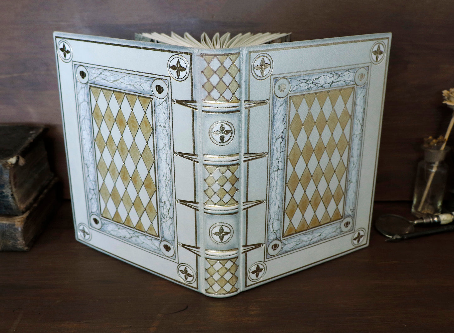 Ivory Dreams. White leather journal with gold tooled and painted decoration. One of a kind.
