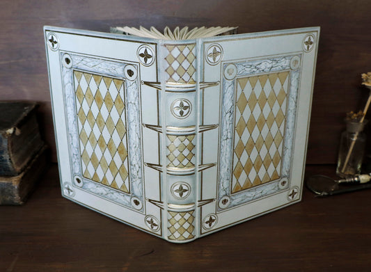 Ivory Dreams. White leather journal with gold tooled and painted decoration. One of a kind.