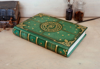 Green leather journal with gold tooled decoration, The Circle of Time