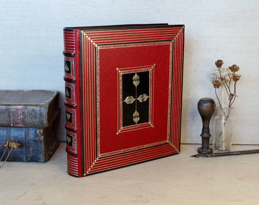 Bright red leather journal with black inlays and gold tooled decoration - The Gilded Labyrinth