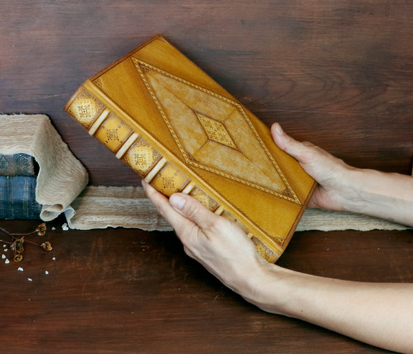 Antiqued yellow leather journal with tooled decoration. Romantic Sunset