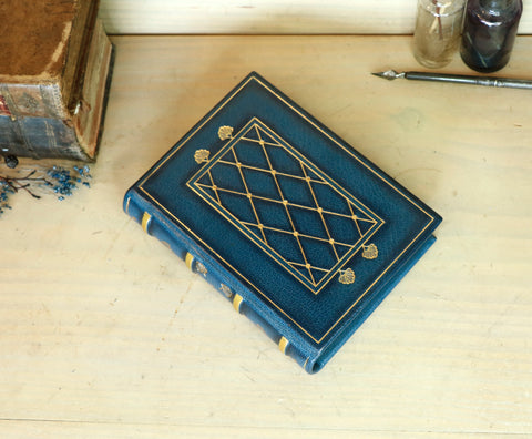 Blue leather journal with gold tooled decoration and painted edges. A Small Treasure