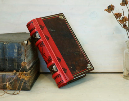 Small Vintage Journals, Brown worn leather with red spine, tooled decoration. The Vow