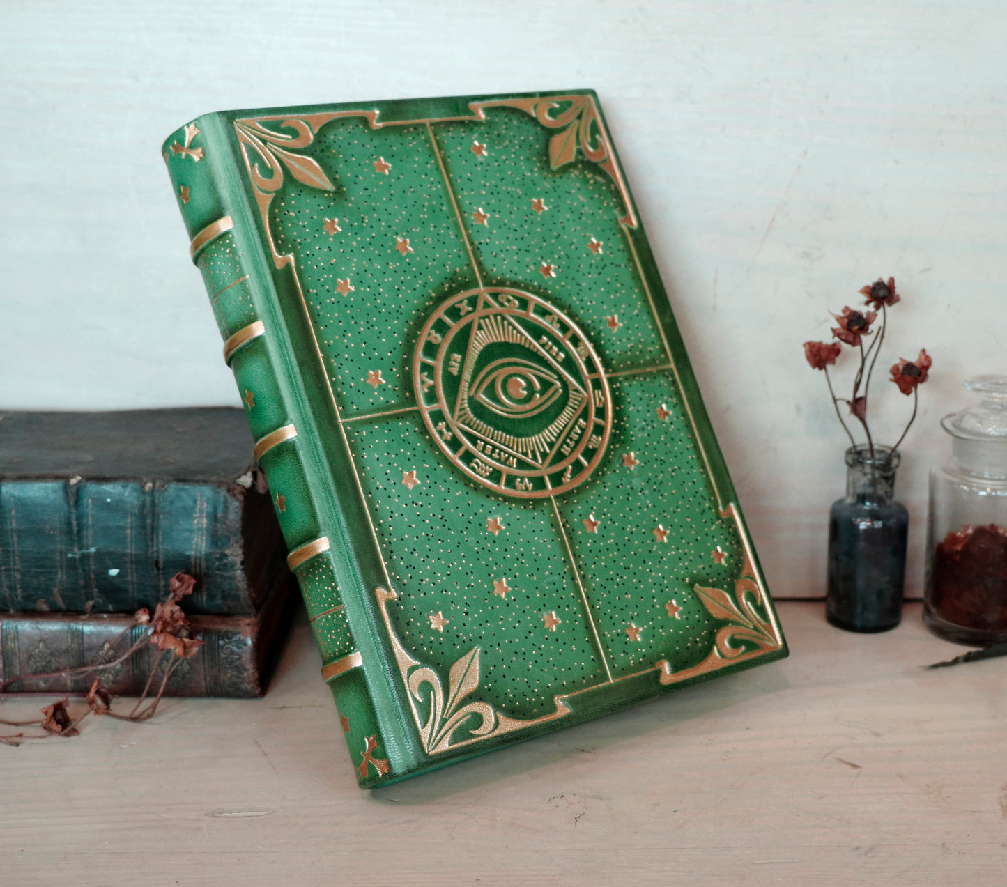 Green leather journal with gold tooled decoration, The Circle of Time