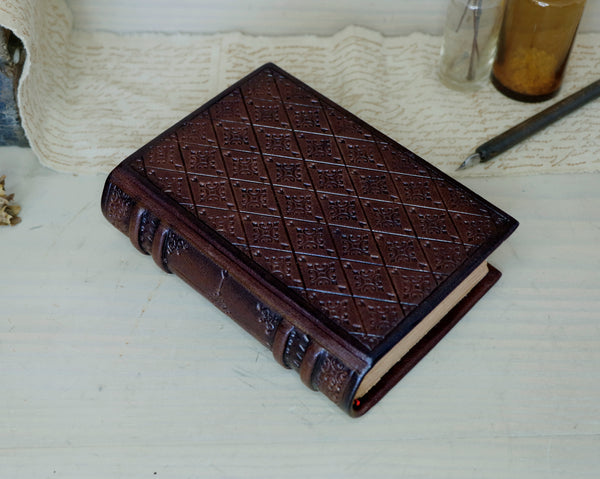 Brown leather journal with blind tooled decoration, Tea stained pages. Dark Chocolate