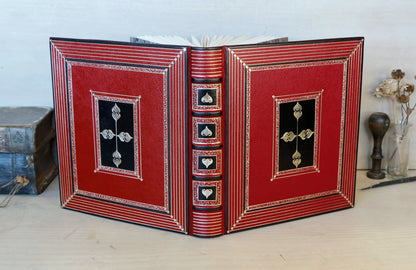Bright red leather journal with black inlays and gold tooled decoration - The Gilded Labyrinth