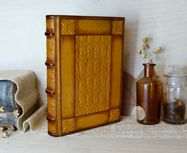 Antiqued yellow leather journal with tooled decoration. Romantic Sunset