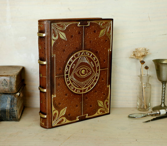 Brown leather journal with tooled decoration, The Circle of Time in Gold