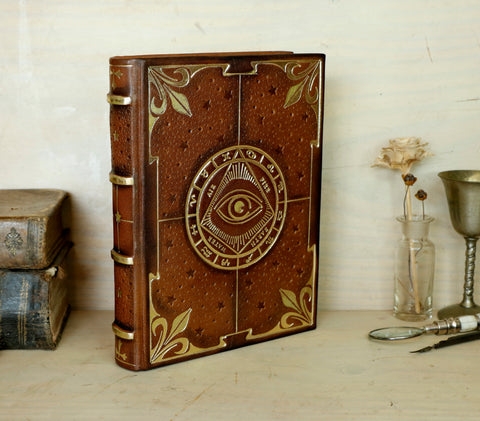 Brown leather journal with tooled decoration, The Circle of Time in Gold