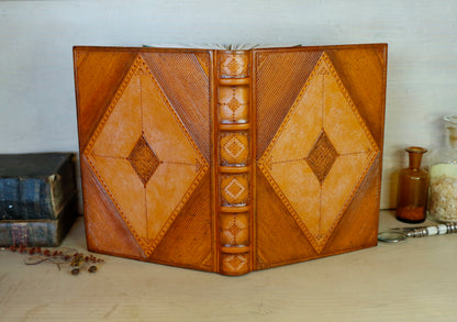 Antiqued orange leather journal with tooled decoration. Romantic Sunset II