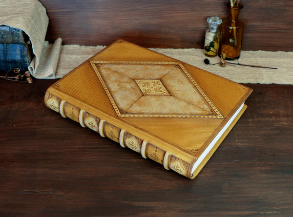 Antiqued yellow leather journal with tooled decoration. Romantic Sunset
