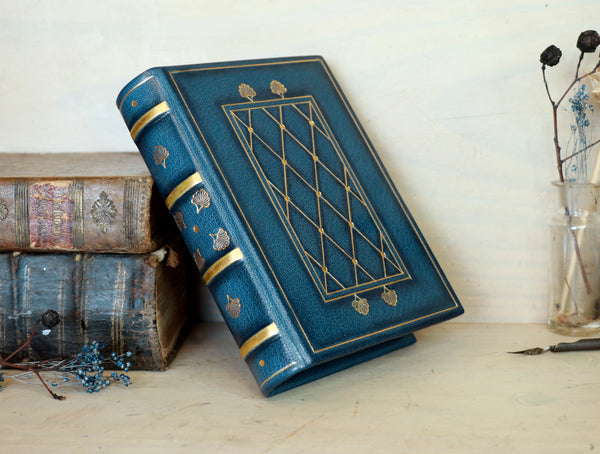 Blue leather journal with gold tooled decoration and painted edges. A Small Treasure