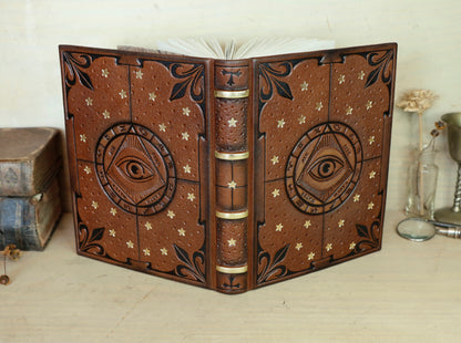 Brown leather journal with tooled decoration, The Circle of Time in Black