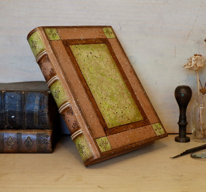 Brown leather journal with tooled and hand painted decoration. Artist paper. Mosslight