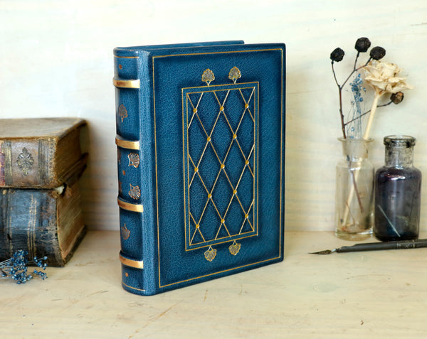 Blue leather journal with gold tooled decoration and painted edges. A Small Treasure