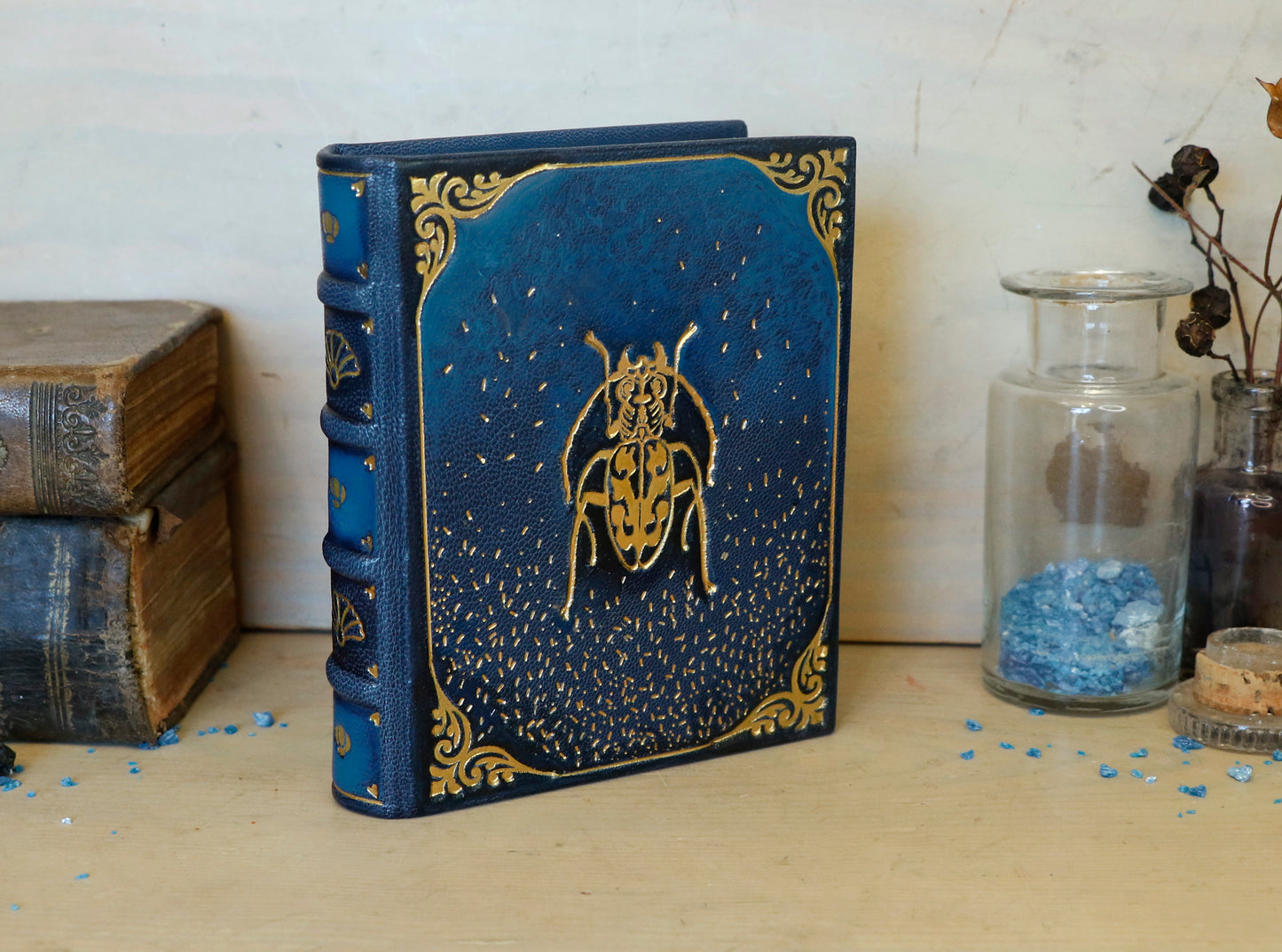 Blue leather journal with gold tooled decoration. Scarab of the Night